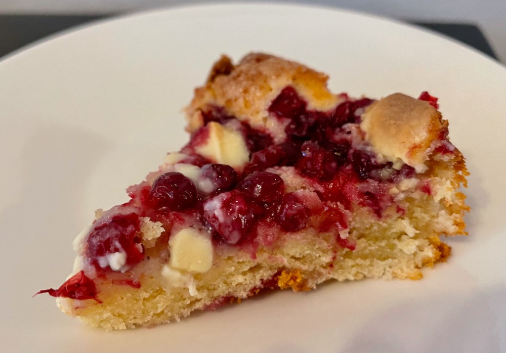 A piece of lingonberry and white chocolate pie on a plate.